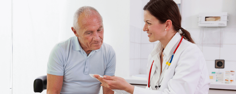 senior man talking with doctor about managing incontinence