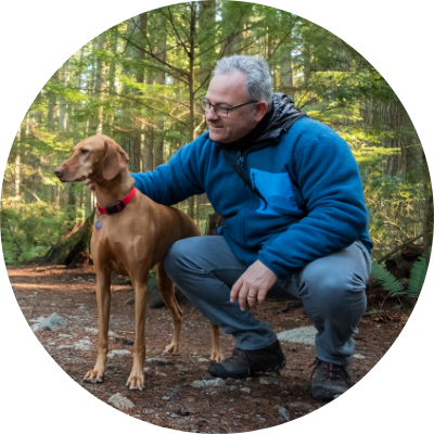 man hiking with dog